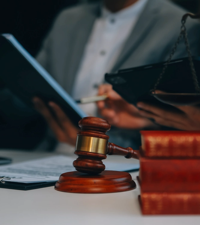gavel on a table as documents are being discussed